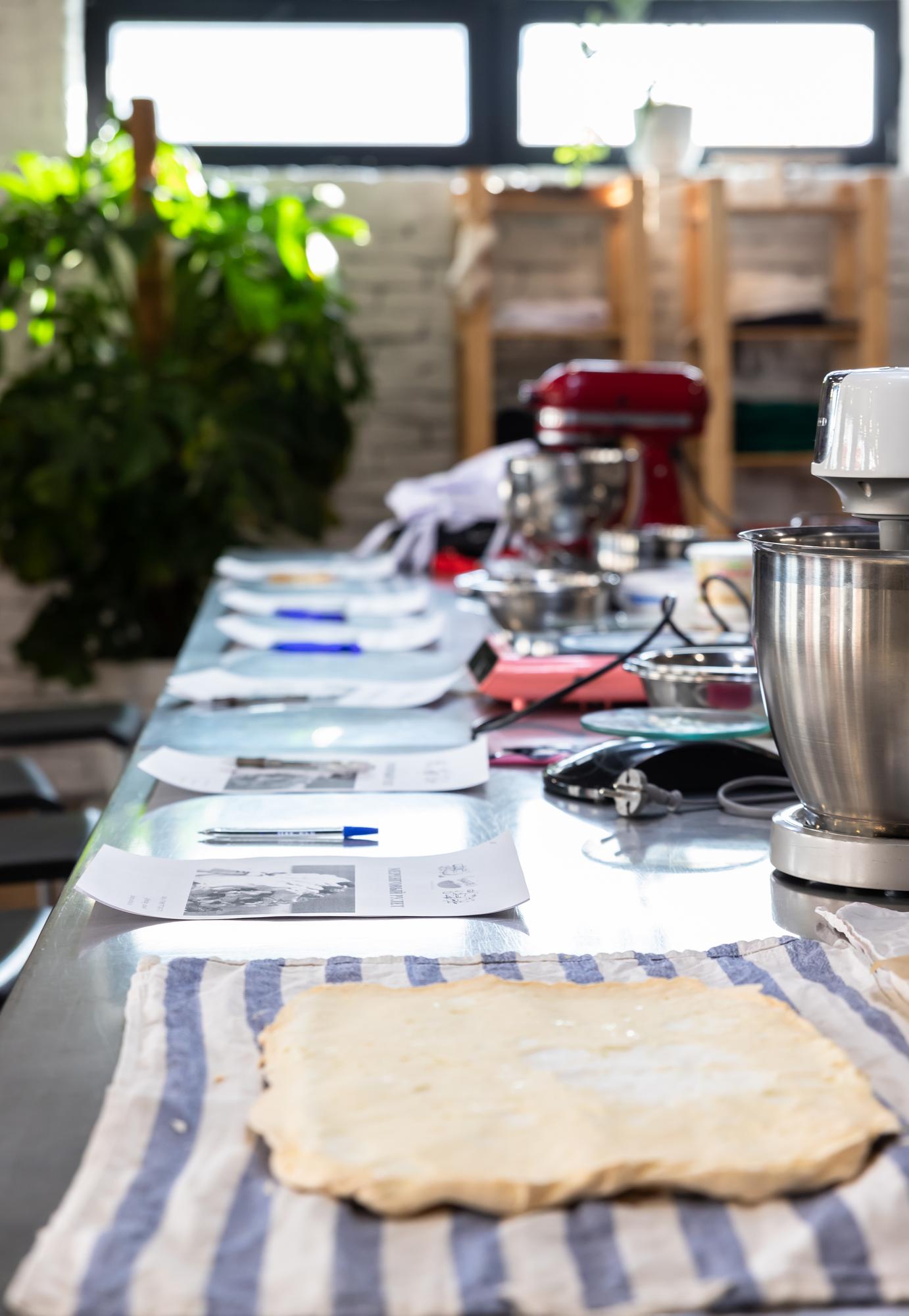 Workshop table with plates and notebooks